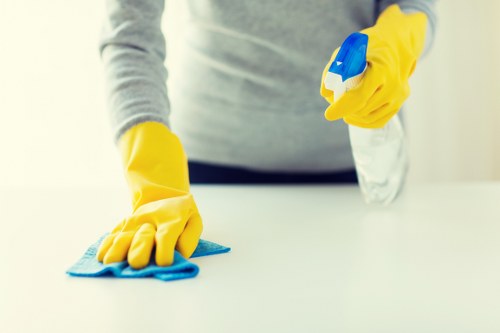 Carpet cleaning staff preparing a safe workspace